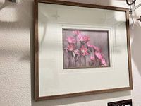Full view of framed floral wall art on wall