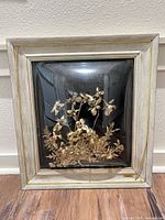 Full front view of framed shadowbox art