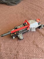 Full view of Goodwrench trolley jack showing overall condition, colors, duct tape repair