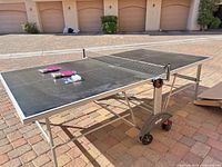 Full view of Kettler Topstar table set up with net and accessories on surface