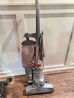 Full view of Kirby upright vacuum standing on floor