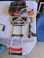 Overview showing hand truck, drain pan, extension cord, Ramset tool, flashlight, scraper, lug wrench