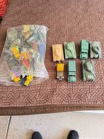 Bag of soldiers and lined-up vehicles overview