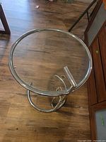 Full view of glass-top chrome side table
