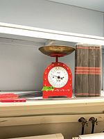 Wide view showing scale, skewers and bundled rods on shelf