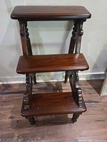 Full view of three-step wood library stool