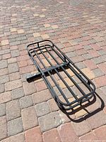 Top view of steel cargo carrier lying on driveway