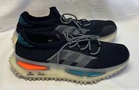 Side profile showing overall design, colorway, midsole inserts