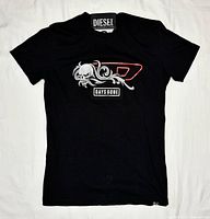 Full front view of black Diesel Days Gone T-shirt laid flat