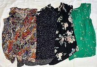 Group shot of all four size-large women’s tops
