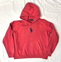 Front view of red Polo Ralph Lauren hoodie showing Big Pony logo and kangaroo pocket