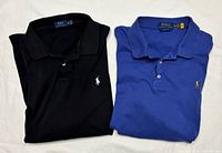 Black and blue Polo Ralph Lauren XXL polo shirts folded side by side