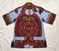 Full front view of shirt showing pattern, pockets and short sleeves