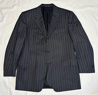 Front view of black pinstripe blazer