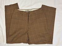 Front view of brown plaid Tommy Hilfiger pants laid flat