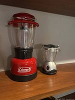 Front view of both lanterns unlit showing design and size comparison