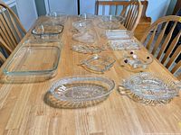 All 14 glass and crystal pieces laid out on table