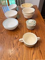 All bowls and sugar dish grouped on table
