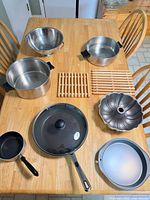 overhead view of all nine cookware pieces arranged on a table