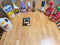 All ten cleaning products arranged on table