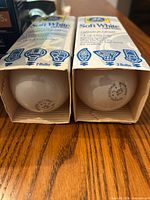Two GE Soft White 2-packs in cardboard sleeves