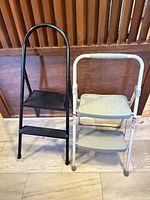 Front view of both folding 2-step stools
