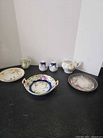 Group shot of all seven porcelain pieces