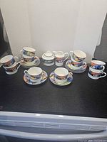 Full set showing cups, saucers, creamer, sugar bowl