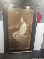 Front view of framed sepia portrait