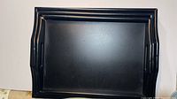 Large black wooden tray front view