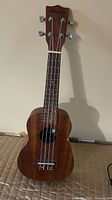 Full front view of mahogany Amahi soprano ukulele
