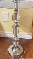 Close view of chrome base and crystal sections of lamp