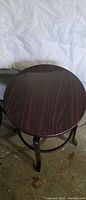 Stool top showing wood-grain seat surface