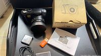 camera, lens, battery, card reader, cable, manual, box