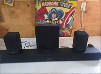 Soundbar front with subwoofer and two satellites