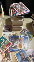 Tall stack of baseball cards with Barry Jones White Sox card on top and spread of other cards