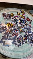 Pile of unsorted Marvel character cards on table