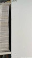 Long storage box filled with densely packed cards viewed from top