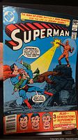 Front cover of Superman 50¢ issue showing action scene with Superman, Jimmy Olsen, and orange monster.