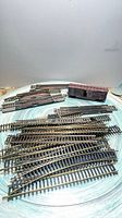 Group of HO track pieces and Southern Pacific boxcar