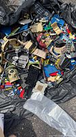 Top view of bin showing variety of Mega Bloks pieces, skull and pirate head