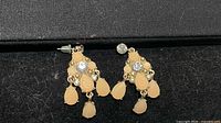 Both earrings side by side showing overall design and stones