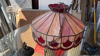 Overall view of stained glass shade on glass table