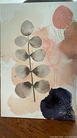 Front view showing entire canvas art with botanical motif