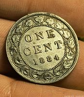 Reverse of 1884 Canadian large cent, maple leaf wreath and denomination