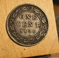 Reverse of 1896 Canadian one cent coin showing date and maple leaf wreath