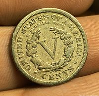 Reverse of 1911 Liberty Head nickel showing V denomination and wreath