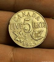 Reverse showing CANADA FIVE CENTS 1929 with maple leaves