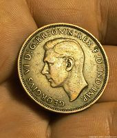 Obverse showing King George VI portrait and legend GEORGIVS VI D:G:BR:OMN:REX F:D:IND:IMP: