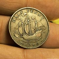 Reverse of 1940 half penny showing ship design